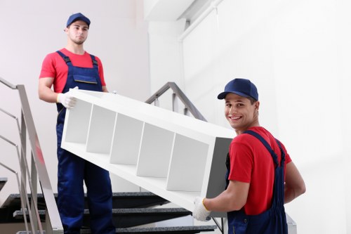 Mover loading boxes from a family home in Dulwich