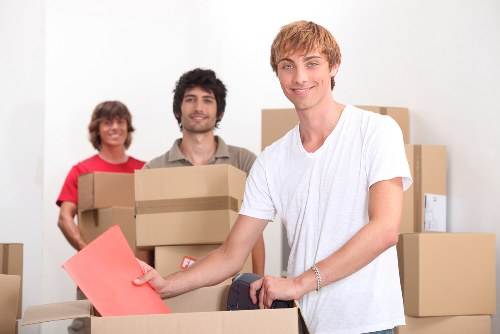 Packed moving boxes and furniture ready for transport in Dulwich